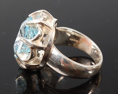 Lot 2574 - A white metal blue topaz single stone ring,...