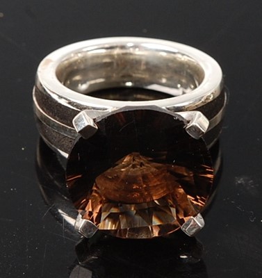 Lot 2575 - A sterling silver smoky quartz dress ring,...