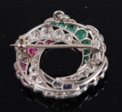 Lot 1235 - A white metal diamond, emerald, ruby and...
