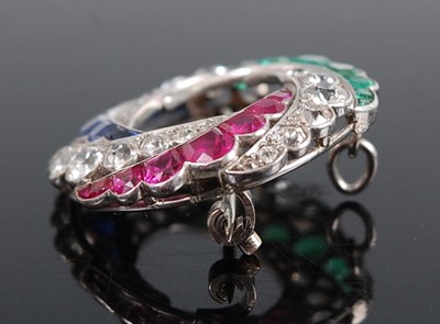 Lot 1235 - A white metal diamond, emerald, ruby and...