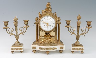 Lot 1354 - A French gilt brass and marble three-piece...