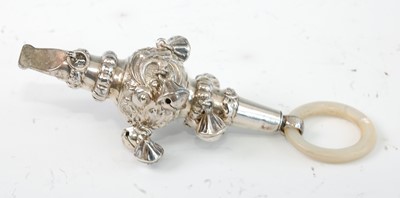 Lot 1170 - A George V silver and embossed rattle, having...