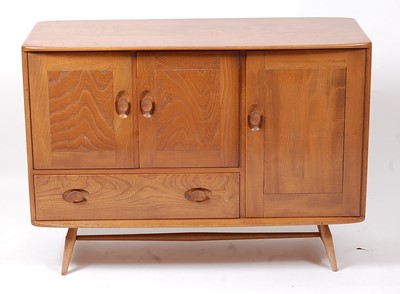 Lot 404 - A 1960s Ercol light elm Windsor sideboard,...