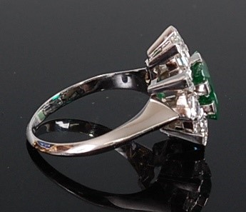 Lot 1231 - A white metal, emerald and diamond rectangular...
