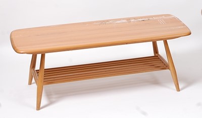 Lot 392 - An Ercol light elm low coffee table, the...