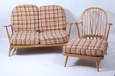 Lot 401 - A 1960s Ercol light elm stickback lounge suite,...