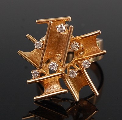 Lot 1234 - A yellow metal diamond abstract dress ring,...