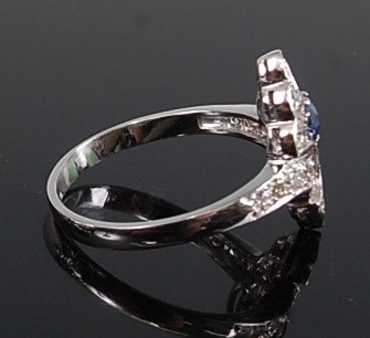 Lot 1232 - A white metal, sapphire and diamond navette...