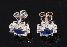 Lot 1185 - A pair of white metal, sapphire and diamond...