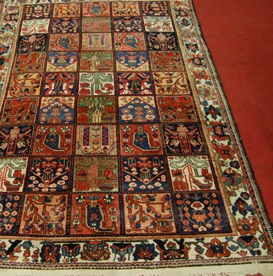 Lot 1368 - A Turkish woollen rug, the ground decorated...