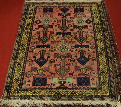 Lot 1369 - A Turkish woollen rug, the pink ground...