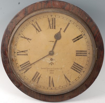 Lot 2365 - A WW II beech cased military wall clock, the...