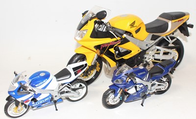 Lot 2335 - A group of 3 plastic motor bikes unboxed as...