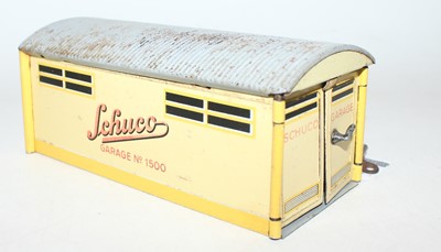 Lot 850 - A Schuco vintage tinplate clockwork car in a...