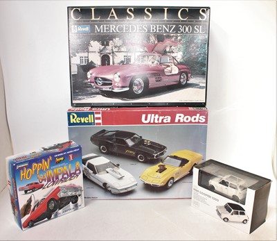 Lot 1065 - Four various boxed plastic and diecast vehicle...