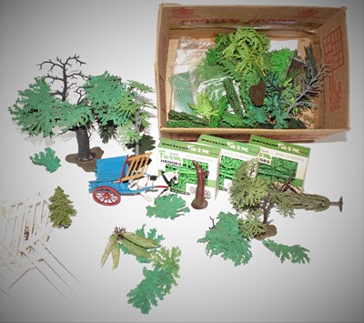 Lot 717 - A quantity of Britains plastic trees unboxed...