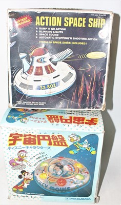 Lot 860 - Agroup of two tinplate space themed toys as...