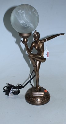 Lot 8 - An Art Deco style bronzed resin table lamp in...