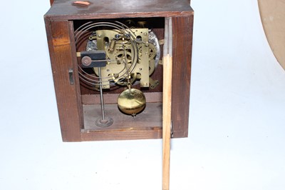 Lot 25 - A 1930s oak cased mantel clock having a...