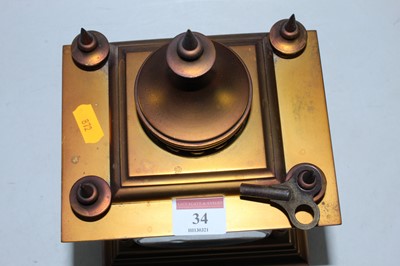 Lot 34 - A late 19th century brass cased mantel clock...