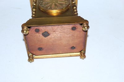 Lot 34 - A late 19th century brass cased mantel clock...