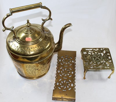 Lot 44 - A large decorative brass kettle with floral...