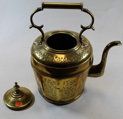 Lot 44 - A large decorative brass kettle with floral...