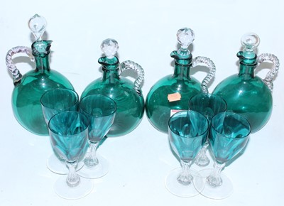 Lot 60 - A set of four Victorian green glass decanters...