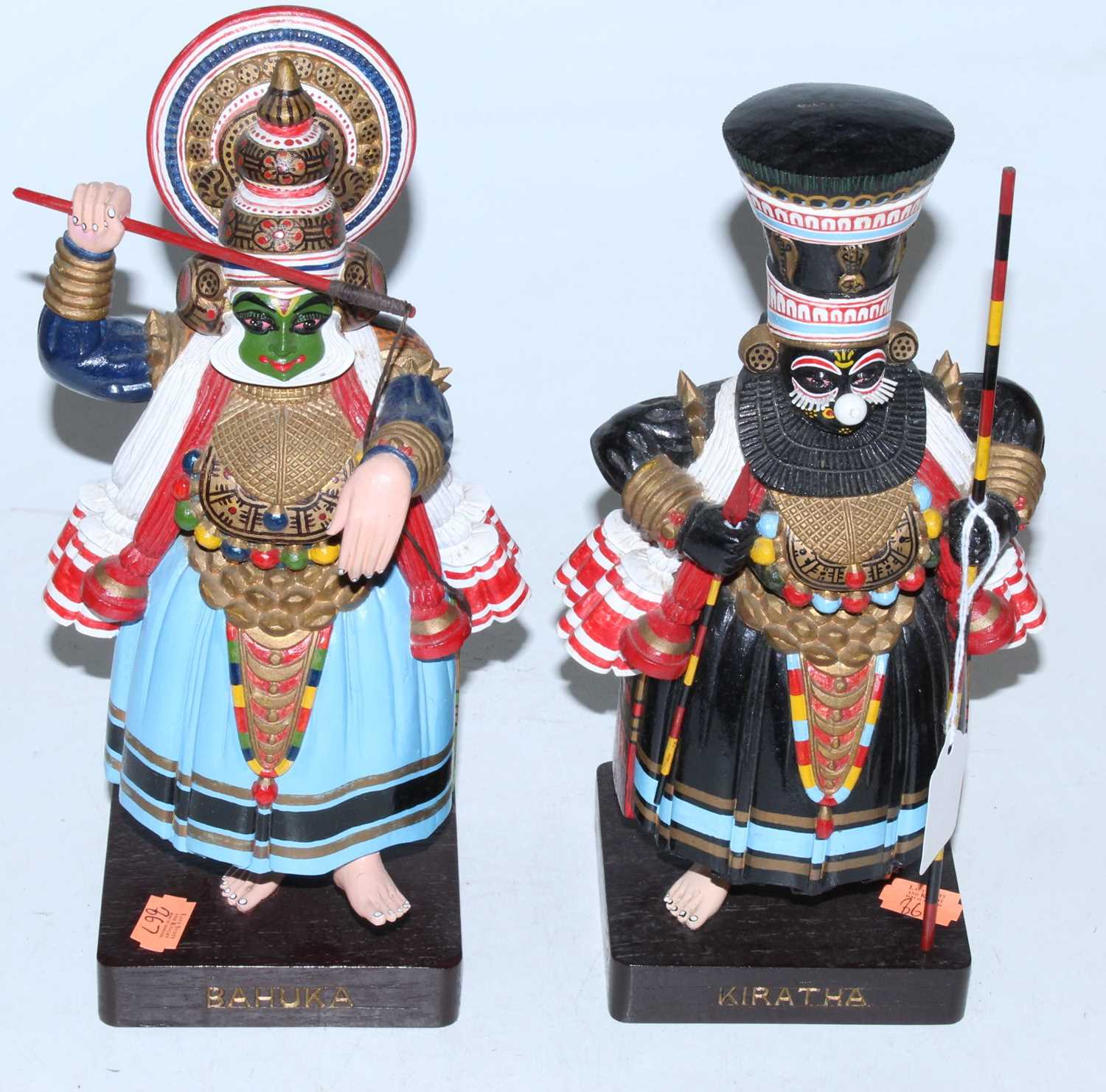 Lot 64 - A pair of polychrome painted ceremonial...