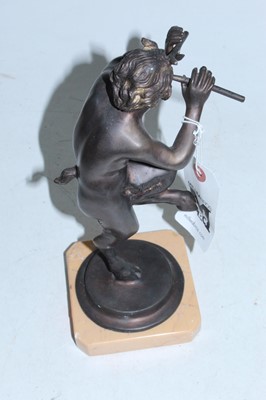 Lot 106 - A reproduction bronzed figure of Pan on a...