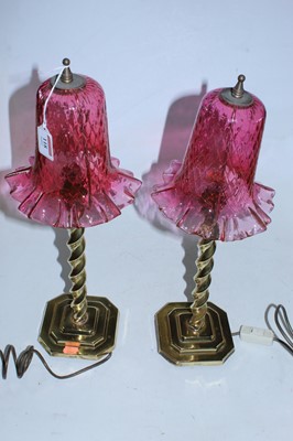 Lot 118 - A pair of table lamps each having a cranberry...