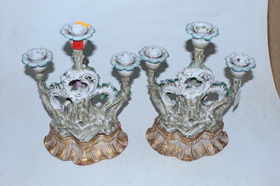 Lot 125 - A pair of reproduction figural candelabra in...