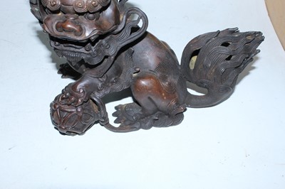 Lot 136 - A pair of bronzed temple dogs, height 19cm