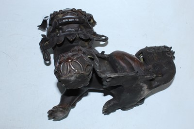 Lot 136 - A pair of bronzed temple dogs, height 19cm