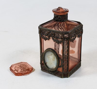 Lot 184 - A 19th century pink tinted and gilt metal...