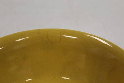 Lot 205 - A Chinese porcelain rice bowl on a yellow...