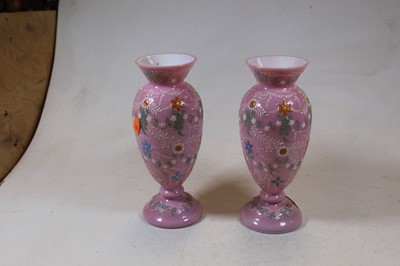 Lot 219 - A pair of Victorian pink glass vases, each...