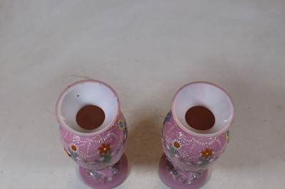 Lot 219 - A pair of Victorian pink glass vases, each...