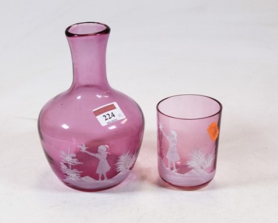 Lot 224 - An amethyst tinted glass carafe with Mary...