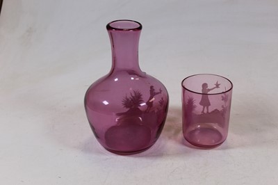 Lot 224 - An amethyst tinted glass carafe with Mary...