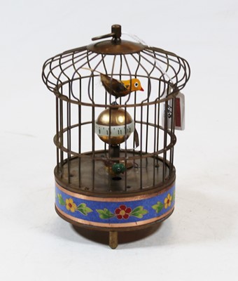 Lot 228 - A reproduction singing bird in cage clockwork...
