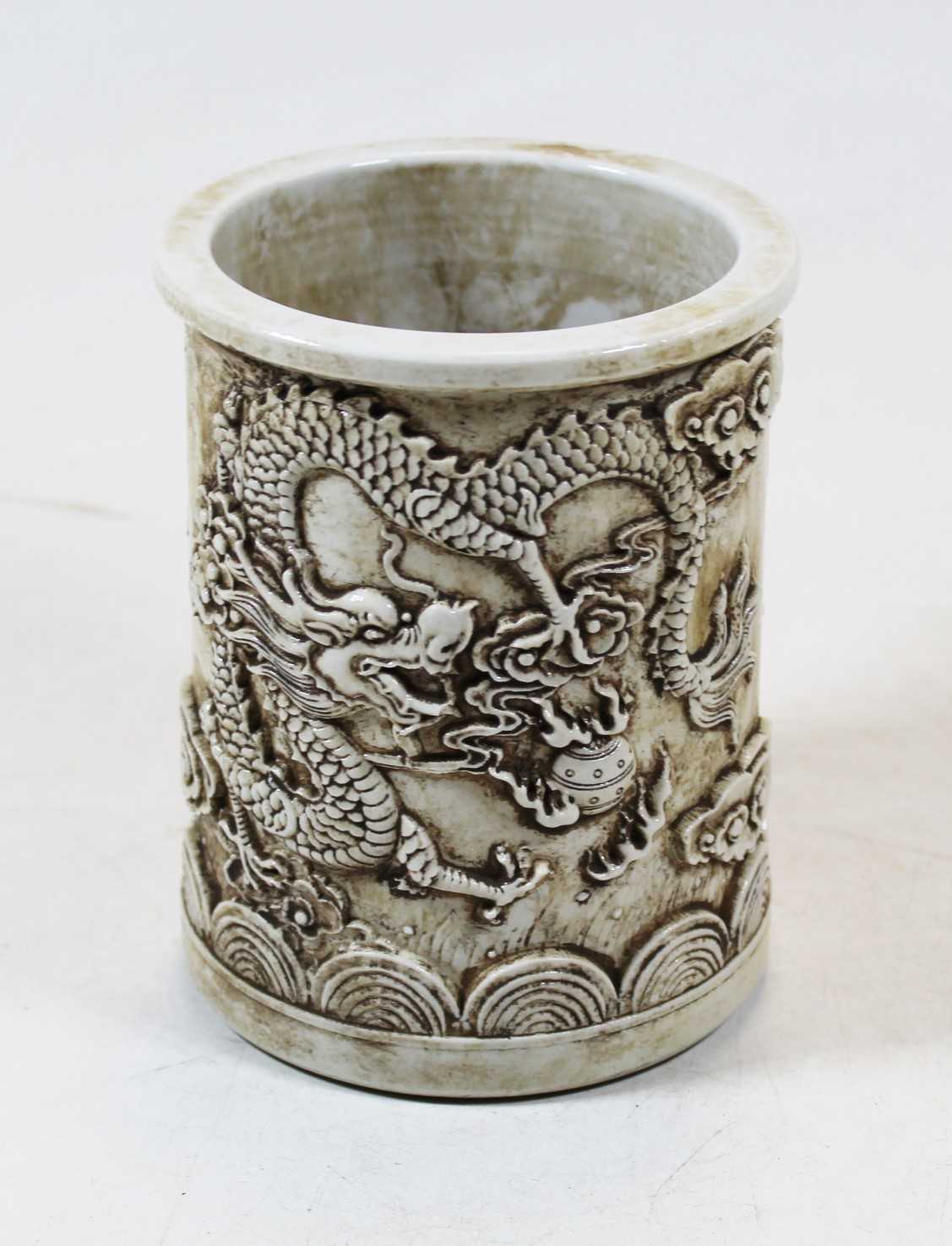 Lot 229 - A reproduction Chinese style brush pot relief...