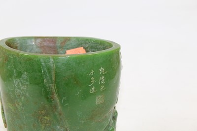 Lot 235 - A Chinese jade coloured brush pot, carved with...