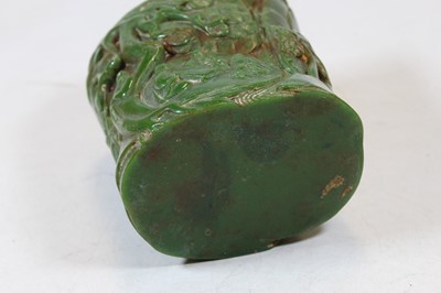 Lot 235 - A Chinese jade coloured brush pot, carved with...