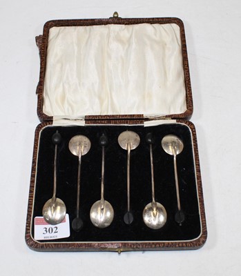 Lot 302 - A cased set of six George V silver coffee bean...