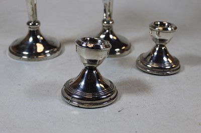 Lot 249 - A pair of modern silver table candlesticks,...