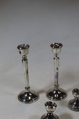Lot 249 - A pair of modern silver table candlesticks,...