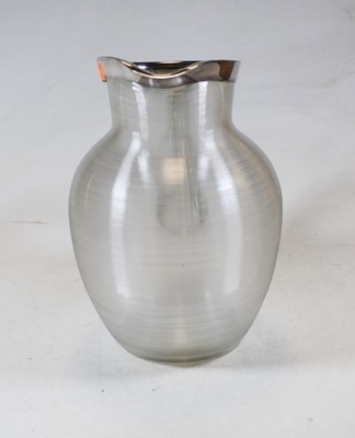 Lot 272 - A large ribbed glass pitcher having white...