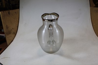 Lot 272 - A large ribbed glass pitcher having white...