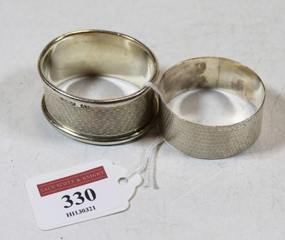 Lot 330 - An engine turned silver napkin ring by Viners;...